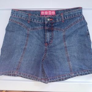 Vintage blue Jean shorts with red trim.